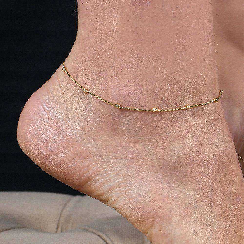 tornozeleira dourada de bolinhas - galeria